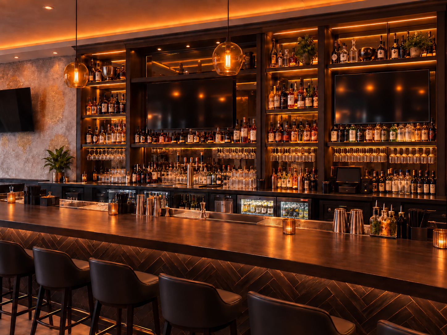 The full bar at Love Story Brooklyn — warm amber lighting, herringbone wood front, and shelves of spirits