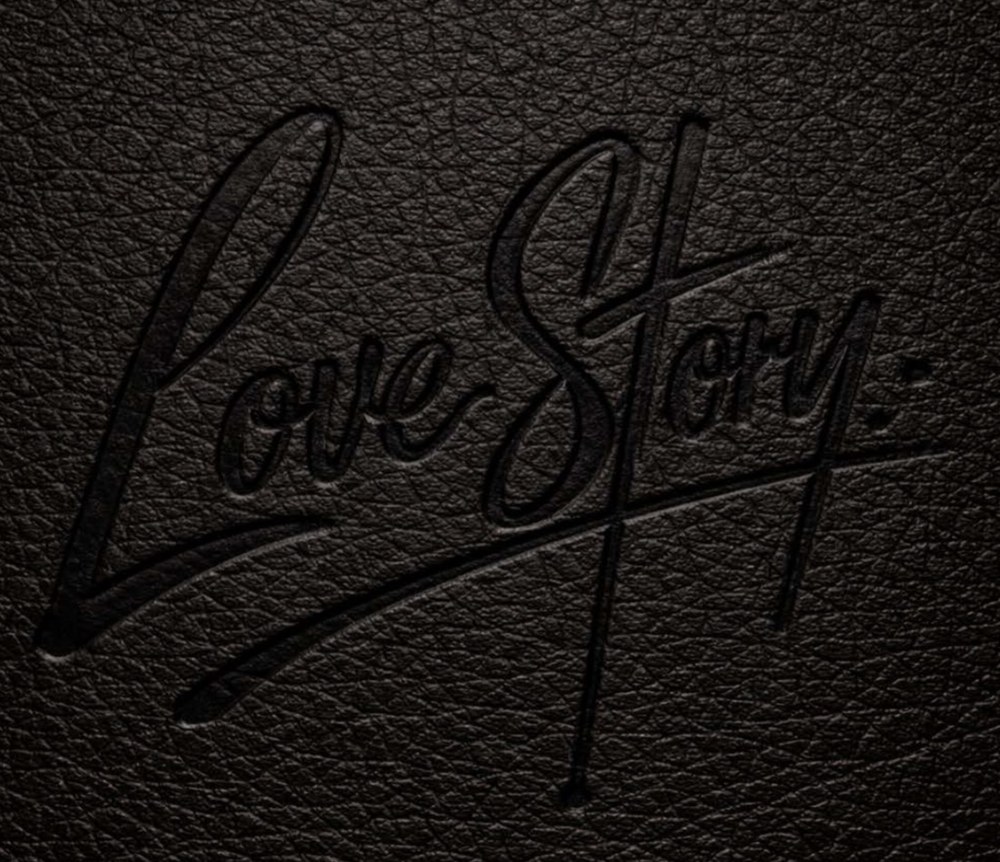 Love Story Brooklyn logo embossed on black leather — Southern, Caribbean and Latin restaurant at 1041 Flushing Avenue, Brooklyn